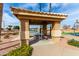 Comfortable pavilion with table and benches, surrounded by lush desert landscaping and palm trees at 7118 E Juanita Ave, Mesa, AZ 85209