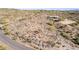 Wide angle aerial view of the desert property, with mature landscaping, on a large lot in a desirable area at 8115 E Paint Pony Dr, Carefree, AZ 85377