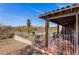 Backyard view of desert landscape featuring covered patio and mountain views at 8115 E Paint Pony Dr, Carefree, AZ 85377