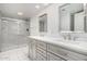 Bathroom featuring dual sinks, vanity, quartz countertop, and a large shower at 8115 E Paint Pony Dr, Carefree, AZ 85377