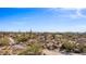 Desert landscape featuring a sprawling community with native trees and cacti on a bright, sunny day at 8115 E Paint Pony Dr, Carefree, AZ 85377