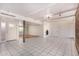 Spacious living room featuring white tile floors, fireplace, and abundant natural light at 8115 E Paint Pony Dr, Carefree, AZ 85377