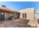 Rear patio featuring flagstone flooring and access doors, offering a seamless indoor-outdoor living experience at 8115 E Paint Pony Dr, Carefree, AZ 85377