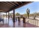 Extensive covered patio with desert views and tiled flooring, perfect for entertaining at 8115 E Paint Pony Dr, Carefree, AZ 85377