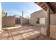 Cozy patio features flagstone flooring, stucco walls, and an entry gate, creating a private outdoor space at 8115 E Paint Pony Dr, Carefree, AZ 85377