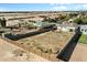 Aerial view showcasing the property's expansive lot and its surrounding neighborhood, with new construction nearby at 815 E Tucci St, San Tan Valley, AZ 85140