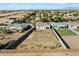 Aerial view of a home's lot and surrounding neighborhood, showcasing its location and community setting at 815 E Tucci St, San Tan Valley, AZ 85140