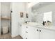 Modern bathroom with double vanity sinks, sleek fixtures, and a large mirror with lots of counter space at 815 E Tucci St, San Tan Valley, AZ 85140