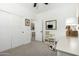 Cozy bedroom featuring a toy kitchen and easy access to the bathroom at 815 E Tucci St, San Tan Valley, AZ 85140