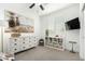 Bedroom with a dresser, television, shelves, and a ceiling fan at 815 E Tucci St, San Tan Valley, AZ 85140