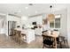 Modern kitchen featuring white cabinets, stainless steel appliances, and a breakfast bar with seating at 815 E Tucci St, San Tan Valley, AZ 85140