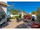 Inviting backyard featuring a cozy seating area with a fire pit and lush landscaping at 8812 E Riviera Dr, Scottsdale, AZ 85260