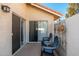 Enclosed patio with tiled flooring, simple seating, and privacy walls, ideal for outdoor relaxation at 8812 E Riviera Dr, Scottsdale, AZ 85260