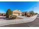 A well-kept single-story home with a two-car garage, desert landscaping, and a blue sky above at 9450 W Georgia Ave, Glendale, AZ 85305