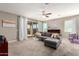 Cozy living room with sliding glass door, plush sectional, and neutral color scheme throughout at 9450 W Georgia Ave, Glendale, AZ 85305