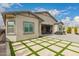 View of the home's beautiful backyard patio with pavers and outdoor kitchen setup at 9749 E Ripple Dr, Mesa, AZ 85212