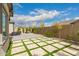 View of the home's outdoor entertaining space featuring a backyard paver patio and desert landscaping at 9749 E Ripple Dr, Mesa, AZ 85212