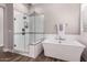 A luxurious soaking tub and walk-in shower make this bathroom a calming retreat at 9749 E Ripple Dr, Mesa, AZ 85212