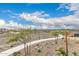 Scenic community park view with walking path and playground under a partly cloudy sky at 9749 E Ripple Dr, Mesa, AZ 85212