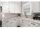 A clean kitchen with white cabinetry, light countertops and stainless coffee machine at 9749 E Ripple Dr, Mesa, AZ 85212