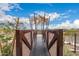 Playground bridge with mesh sides connecting climbing features in a community park at 9749 E Ripple Dr, Mesa, AZ 85212