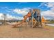 Modern community playground with climbing structures and a slide at 9749 E Ripple Dr, Mesa, AZ 85212