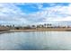 Expansive water feature reflecting the clear blue sky and landscaping in the community at 9749 E Ripple Dr, Mesa, AZ 85212