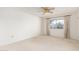Bedroom with a ceiling fan, window, and carpeted floor at 10103 W Saddle Ridge Dr, Sun City, AZ 85373