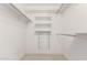 Walk-in closet with multiple shelves and chrome rack at 10103 W Saddle Ridge Dr, Sun City, AZ 85373