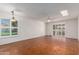 Inviting living room with tile floors, ceiling fan, and window views at 10103 W Saddle Ridge Dr, Sun City, AZ 85373
