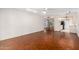 Spacious living area with wood floors and seamless flow to the kitchen at 10103 W Saddle Ridge Dr, Sun City, AZ 85373