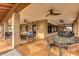 Inviting outdoor patio with ceiling fans, brick columns, and comfortable seating overlooking a scenic view at 10103 W Saddle Ridge Dr, Sun City, AZ 85373
