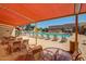 Relax poolside in this community space, featuring ample seating, shade, and a clear view of the pool at 10103 W Saddle Ridge Dr, Sun City, AZ 85373