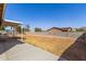 Spacious backyard featuring a covered patio, a well-maintained wall, and ample room for outdoor activities at 1022 W Watson Dr, Tempe, AZ 85283