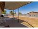 Spacious backyard featuring a covered patio, a well-maintained wall, and ample room for outdoor activities at 1022 W Watson Dr, Tempe, AZ 85283