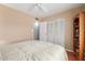 Bedroom with ample closet space, a ceiling fan, and access to a bathroom, ensuring comfort and convenience at 1022 W Watson Dr, Tempe, AZ 85283