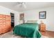 Bedroom boasting carpet flooring, a ceiling fan and a closet with ample space for storage at 1022 W Watson Dr, Tempe, AZ 85283
