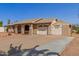 Single-story home with a large driveway and additional covered parking at 1022 W Watson Dr, Tempe, AZ 85283
