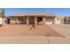 Charming single-story home with desert landscaping, and inviting covered porch at 1022 W Watson Dr, Tempe, AZ 85283