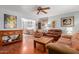 Cozy living room with wooden floors and a view into the dining area at 1022 W Watson Dr, Tempe, AZ 85283
