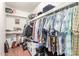 Well-organized walk-in closet with hanging racks and shelves for storage, perfect for clothing and accessories at 1022 W Watson Dr, Tempe, AZ 85283