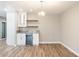 Dry bar with shelving, bar refrigerator, and quartz countertop at 10404 W Tropicana S Cir, Sun City, AZ 85351