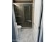Newly remodeled bathroom featuring a clear glass shower and marble floors at 10404 W Tropicana S Cir, Sun City, AZ 85351
