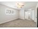 Spacious bedroom featuring a ceiling fan and a sliding barn door at 10404 W Tropicana S Cir, Sun City, AZ 85351