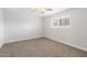 Cozy bedroom featuring carpet, a window with blinds, and electric outlets at 10404 W Tropicana S Cir, Sun City, AZ 85351