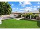 Charming single story home with well-maintained lawn, desert landscaping and covered parking at 10404 W Tropicana S Cir, Sun City, AZ 85351