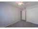 Comfortable bedroom with carpet, a ceiling fan, and a closet at 1110 W Seagull Dr, Chandler, AZ 85286