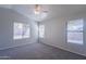 This bedroom features multiple windows that provide abundant natural light and an airy atmosphere at 1110 W Seagull Dr, Chandler, AZ 85286