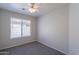 This bedroom features a ceiling fan and a window, offering both comfort and natural light at 1110 W Seagull Dr, Chandler, AZ 85286