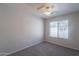 Cozy bedroom with carpet flooring, neutral walls, and a bright window at 1110 W Seagull Dr, Chandler, AZ 85286